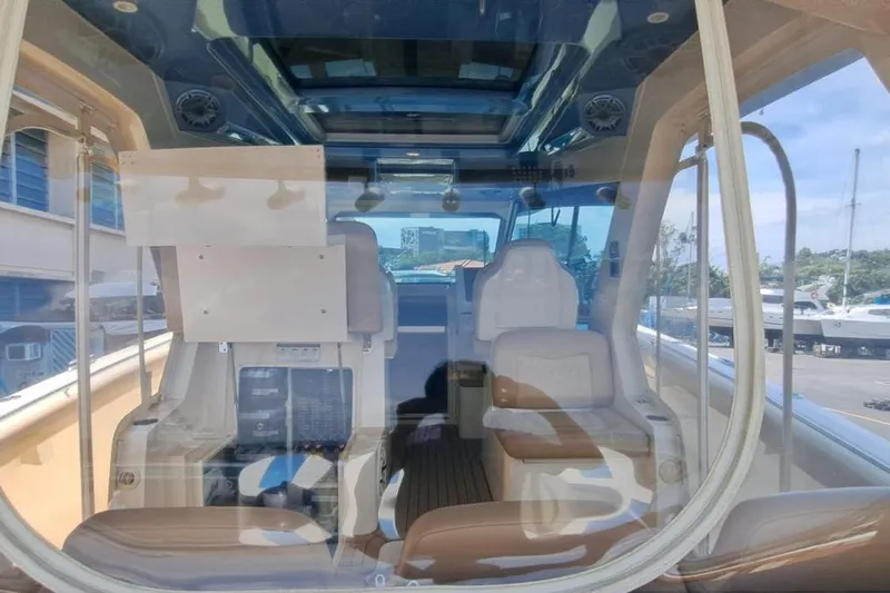  Yacht Photos Pics Interior view of 2022 Scout 530 LXF luxury boat with plush seating and modern design.