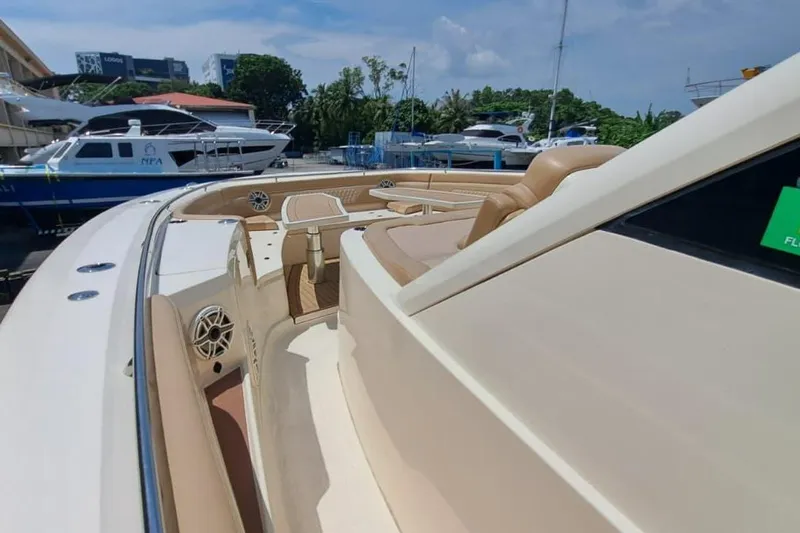  Yacht Photos Pics 2022 Scout 530 LXF luxury yacht with beige seating and sleek design in marina setting.