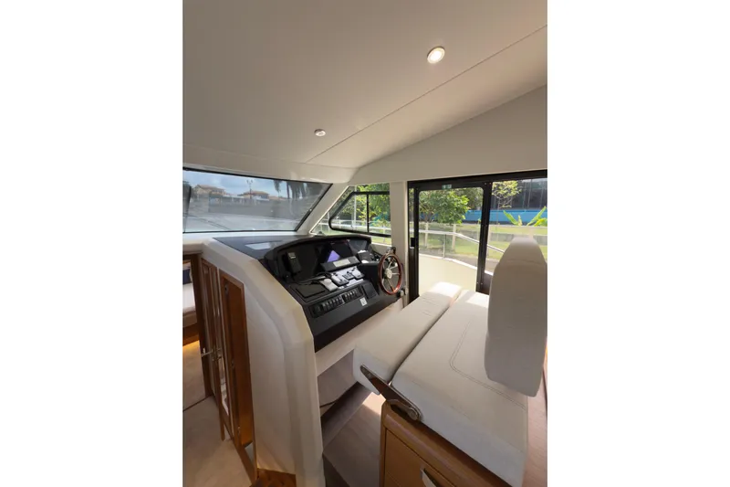 Waxing Gibbous Yacht Photos Pics 2024 Greenline 48 Fly yacht interior helm with modern controls and seating.