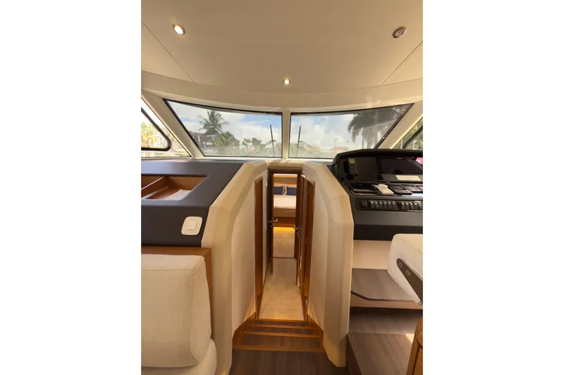 Waxing Gibbous Yacht Photos Pics Interior view of 2024 Greenline 48 Fly yacht cockpit with modern design and panoramic windows.