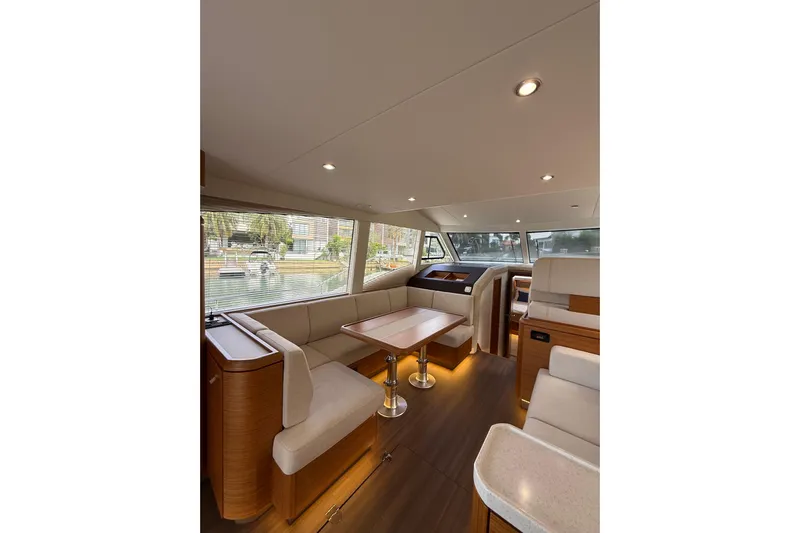 Waxing Gibbous Yacht Photos Pics Luxurious interior of 2024 Greenline 48 Fly yacht with elegant seating and modern design.