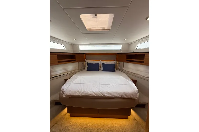 Waxing Gibbous Yacht Photos Pics Luxurious cabin interior of 2024 Greenline 48 Fly yacht with elegant bedding.