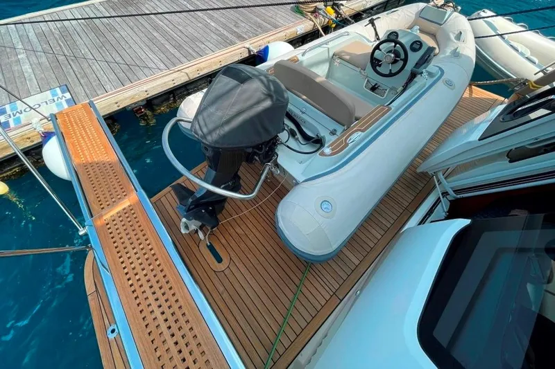  Yacht Photos Pics Luxury Absolute NAVETTA 58 yacht with inflatable tender on teak deck, 2018 model.