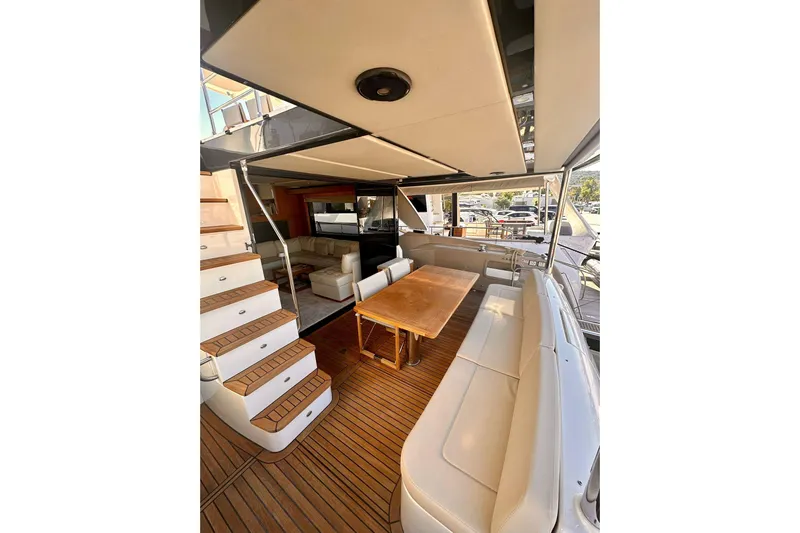 Yacht Photos Pics Luxurious 2018 Absolute NAVETTA 58 yacht interior with elegant seating and wooden flooring.
