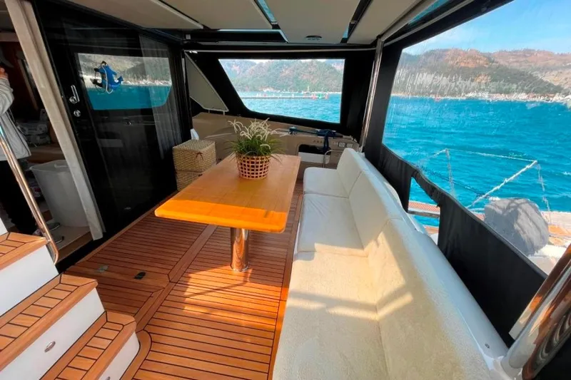  Yacht Photos Pics Luxurious 2018 Absolute NAVETTA 58 yacht interior with elegant seating and ocean view.