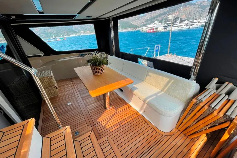  Yacht Photos Pics Luxurious 2018 Absolute NAVETTA 58 yacht interior with wooden deck and scenic ocean view.