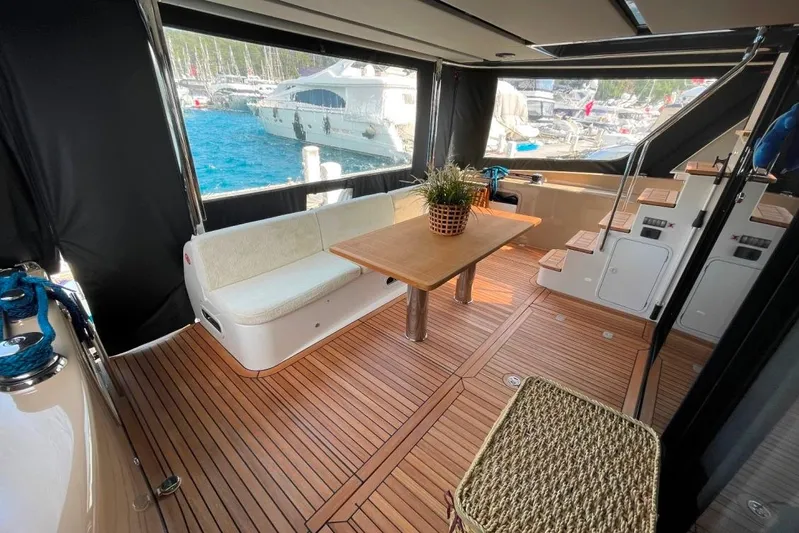  Yacht Photos Pics Luxurious 2018 Absolute NAVETTA 58 yacht interior with wooden flooring and elegant seating.