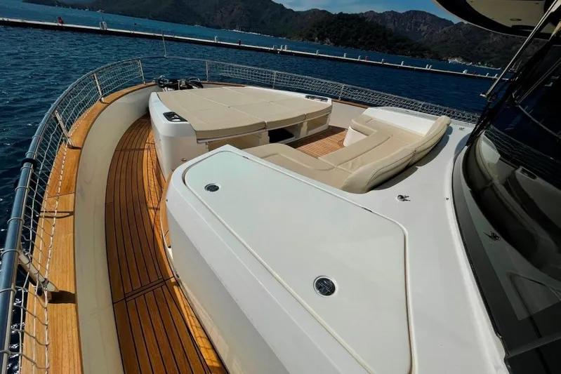  Yacht Photos Pics Luxurious 2018 Absolute NAVETTA 58 yacht deck with elegant seating and scenic ocean view.