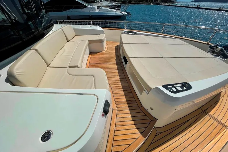  Yacht Photos Pics Luxurious 2018 Absolute NAVETTA 58 yacht deck with beige seating and wooden flooring.