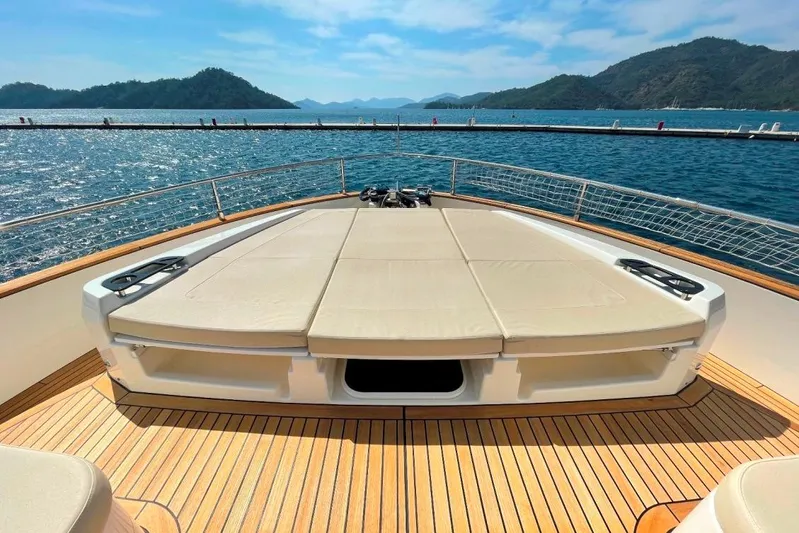  Yacht Photos Pics Luxurious 2018 Absolute NAVETTA 58 yacht deck with sunbed, scenic ocean view.