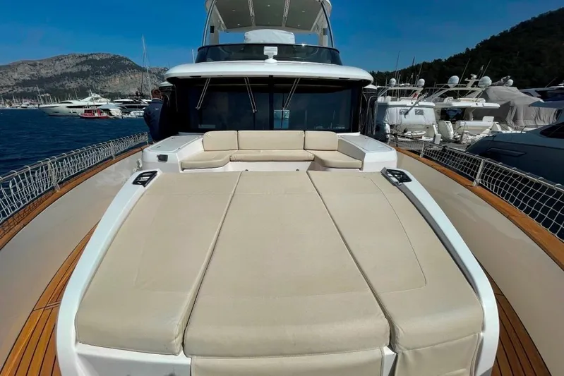  Yacht Photos Pics Luxurious 2018 Absolute NAVETTA 58 yacht with spacious sunbathing deck, docked in scenic marina.