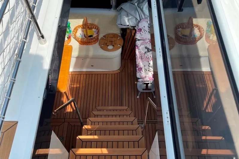  Yacht Photos Pics Luxurious 2018 Absolute NAVETTA 58 yacht interior with wooden flooring and cozy seating area.