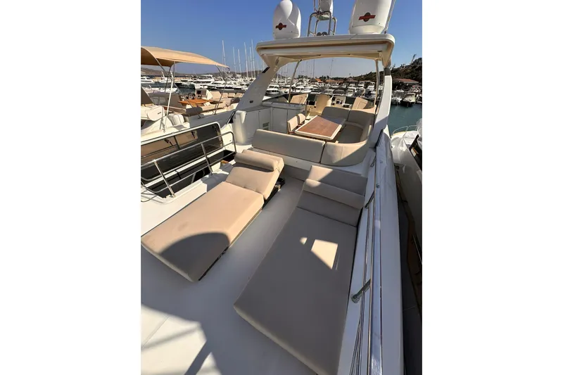  Yacht Photos Pics Luxurious 2018 Absolute NAVETTA 58 yacht with spacious sunbathing deck and elegant seating area.