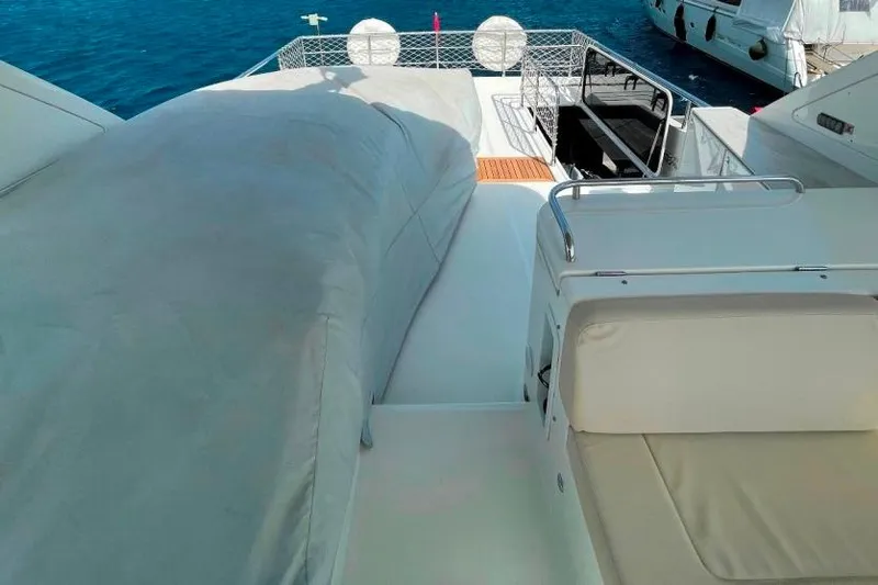  Yacht Photos Pics 2018 Absolute NAVETTA 58 yacht deck with seating and covered equipment.