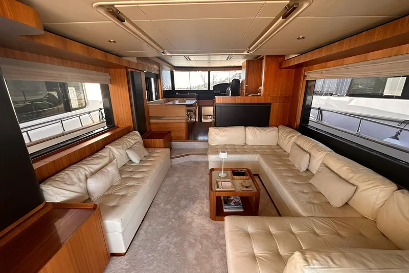  Yacht Photos Pics Luxurious interior of 2018 Absolute NAVETTA 58 yacht with plush seating and elegant wood finishes.