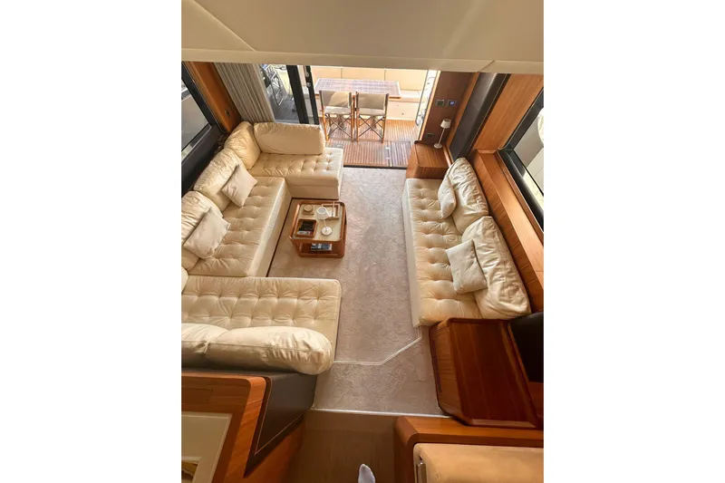  Yacht Photos Pics Luxurious interior of 2018 Absolute NAVETTA 58 yacht with plush seating and elegant decor.