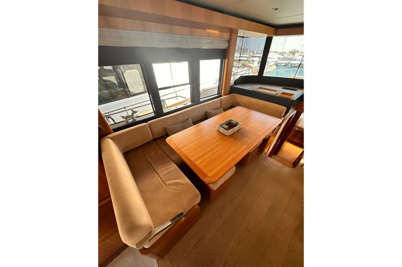  Yacht Photos Pics Luxurious interior of 2018 Absolute NAVETTA 58 yacht with elegant dining area.