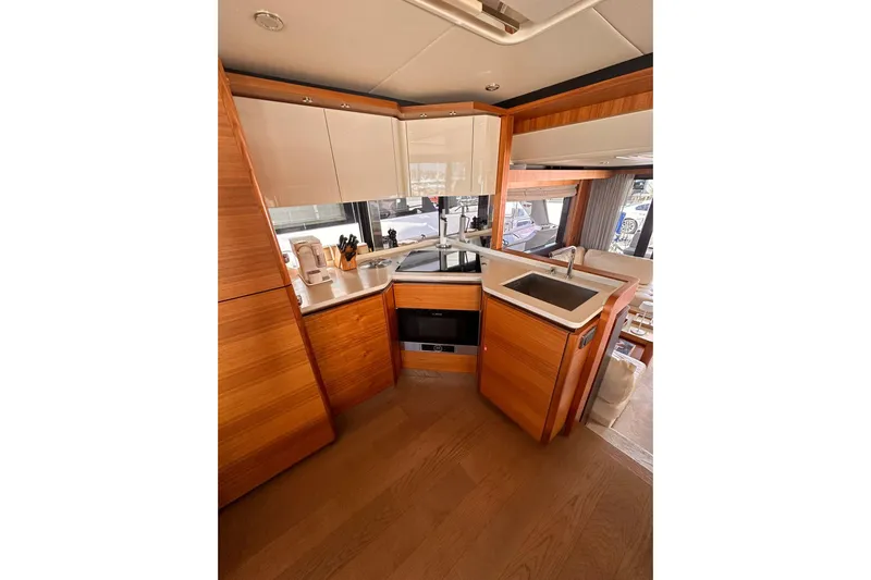  Yacht Photos Pics Luxurious kitchen interior of 2018 Absolute NAVETTA 58 yacht with modern amenities.