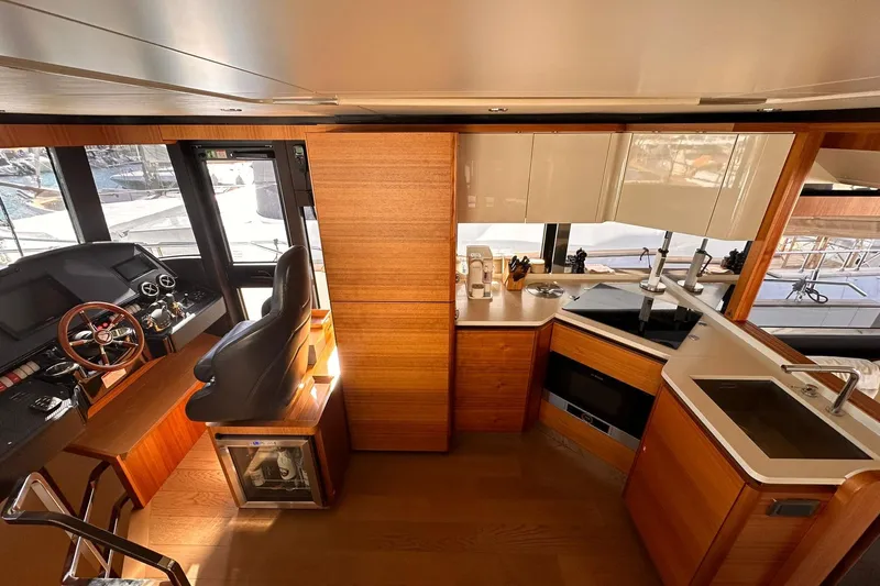  Yacht Photos Pics Luxurious interior of 2018 Absolute NAVETTA 58 yacht with modern kitchen and helm station.