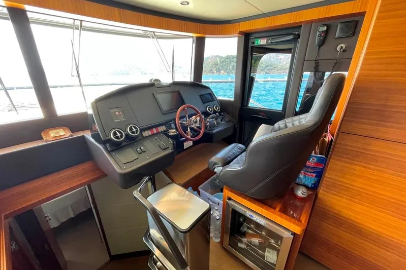  Yacht Photos Pics Pilothouse of 2018 Absolute NAVETTA 58 yacht with modern controls and leather seating.