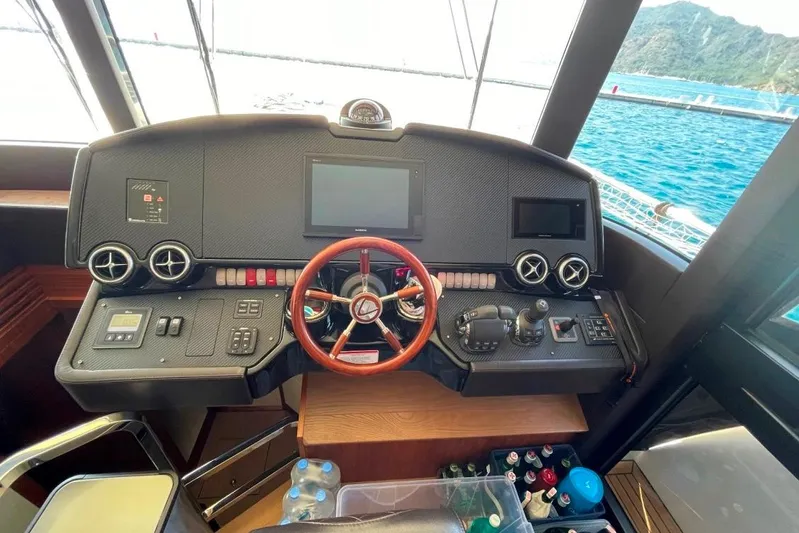  Yacht Photos Pics Cockpit of 2018 Absolute NAVETTA 58 yacht with steering wheel and control panels.