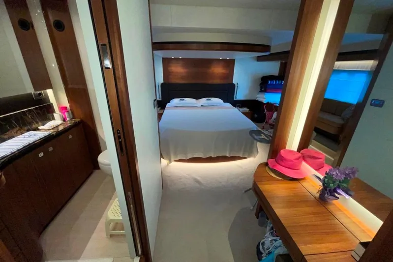  Yacht Photos Pics Luxurious bedroom interior of 2018 Absolute NAVETTA 58 yacht with elegant wood finishes.