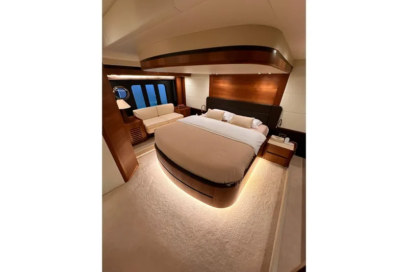  Yacht Photos Pics Luxurious bedroom interior of 2018 Absolute NAVETTA 58 yacht with elegant lighting and furnishings.