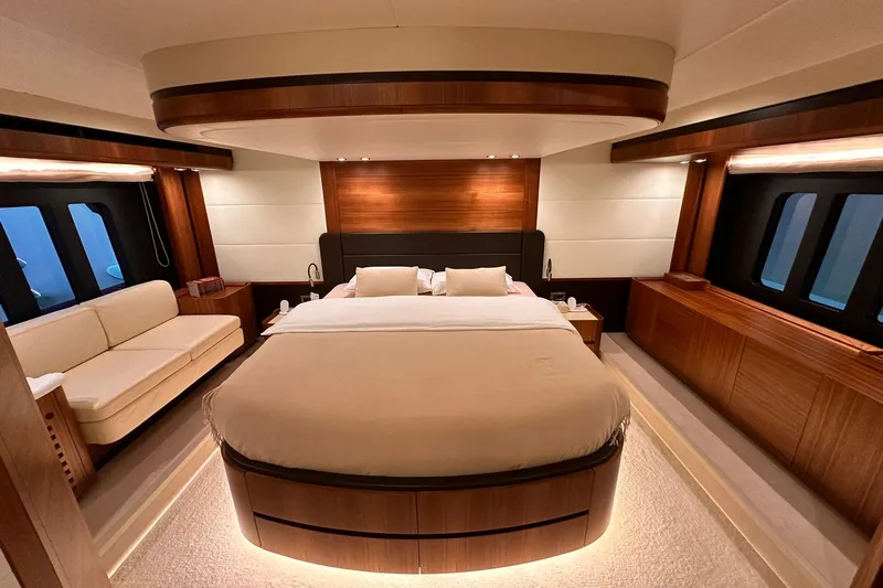  Yacht Photos Pics Luxurious bedroom interior of 2018 Absolute NAVETTA 58 yacht with elegant wood finishes.