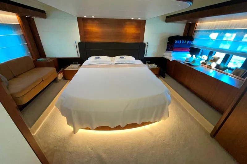  Yacht Photos Pics Luxurious bedroom interior of 2018 Absolute NAVETTA 58 yacht with modern design and ambient lighting.