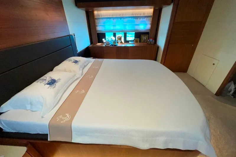  Yacht Photos Pics Luxurious bedroom interior on 2018 Absolute NAVETTA 58 yacht, featuring elegant bedding and wood accents.