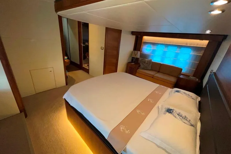  Yacht Photos Pics Luxurious bedroom interior of 2018 Absolute NAVETTA 58 yacht with modern design and ambient lighting.