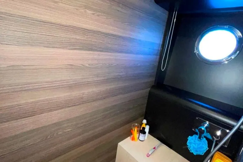  Yacht Photos Pics Interior of 2018 Absolute NAVETTA 58 yacht bathroom with porthole and toiletries.