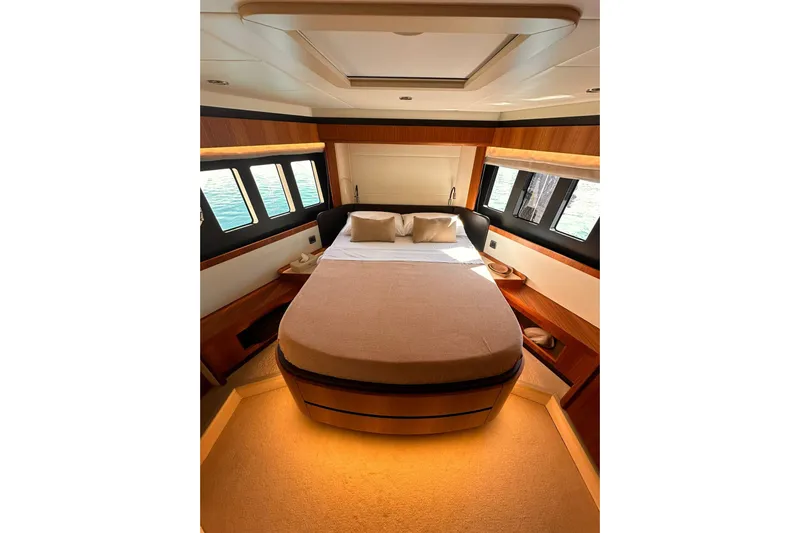  Yacht Photos Pics Luxurious bedroom interior of 2018 Absolute NAVETTA 58 yacht with elegant wood finishes.
