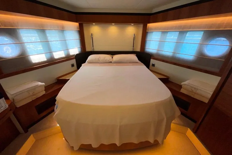  Yacht Photos Pics Luxurious bedroom interior of 2018 Absolute NAVETTA 58 yacht with elegant lighting and bedding.