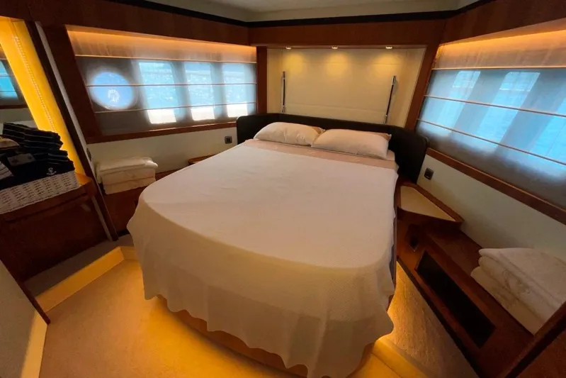  Yacht Photos Pics Luxurious bedroom interior of 2018 Absolute NAVETTA 58 yacht with elegant lighting and cozy bedding.