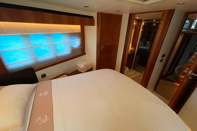  Yacht Photos Pics Luxurious bedroom interior of 2018 Absolute NAVETTA 58 yacht with elegant wood finishes.