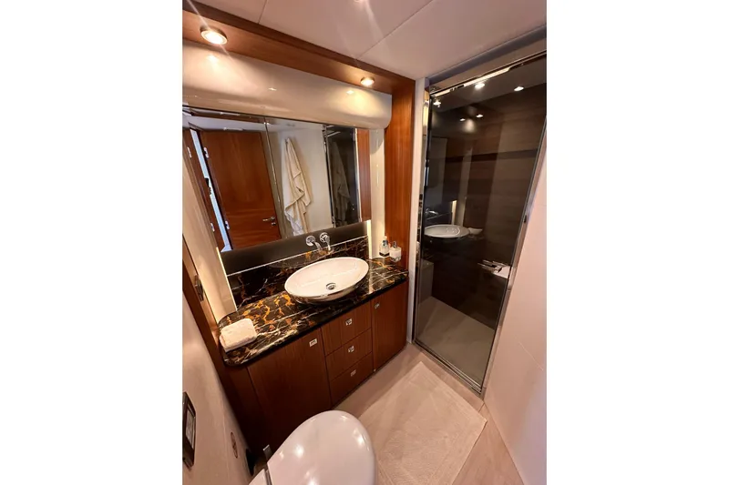  Yacht Photos Pics Luxurious bathroom in 2018 Absolute NAVETTA 58 yacht with elegant fixtures and marble countertop.