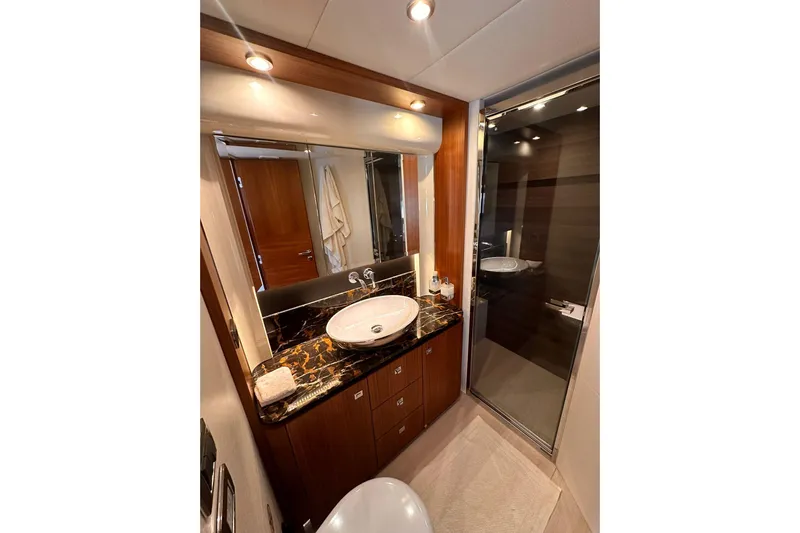  Yacht Photos Pics Luxurious bathroom in 2018 Absolute NAVETTA 58 yacht with elegant fixtures and marble countertop.