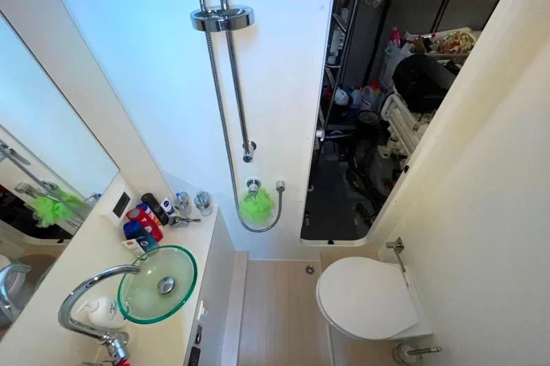  Yacht Photos Pics Bathroom interior of 2018 Absolute NAVETTA 58 yacht with modern fixtures and glass sink.