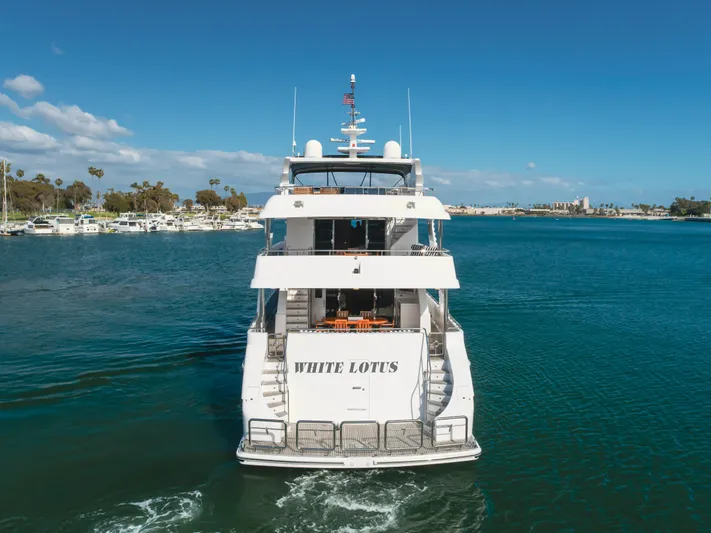 White Lotus Yacht Photos Pics Luxury yacht "White Lotus" on water, 2011 President Sterling Tri-Deck, clear sky, marina background.