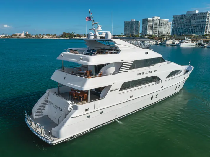 White Lotus Yacht Photos Pics Luxurious 2011 President Sterling Tri-Deck yacht cruising in a scenic marina.