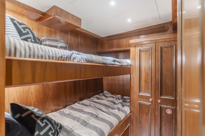 White Lotus Yacht Photos Pics Luxurious wooden bunk beds in 2011 President Sterling Tri-Deck yacht cabin.