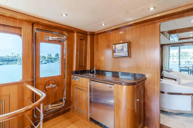 White Lotus Yacht Photos Pics Luxurious 2011 President Sterling Tri-Deck yacht interior with wood paneling and modern amenities.