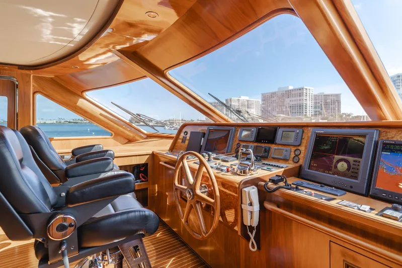 White Lotus Yacht Photos Pics Luxurious 2011 President Sterling Tri-Deck yacht helm with modern navigation equipment and panoramic views.