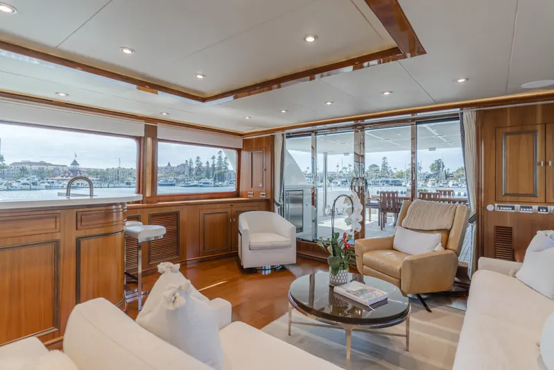 White Lotus Yacht Photos Pics Luxurious 2011 President Sterling Tri-Deck yacht interior with elegant seating and panoramic views.