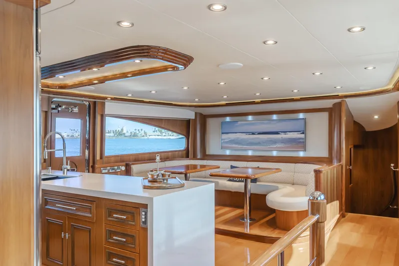White Lotus Yacht Photos Pics Luxurious interior of 2011 President Sterling Tri-Deck yacht with elegant wood finishes.