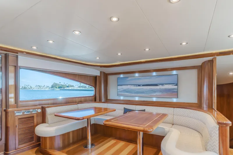 White Lotus Yacht Photos Pics Luxurious 2011 President Sterling Tri-Deck yacht interior with elegant dining area and ocean view.