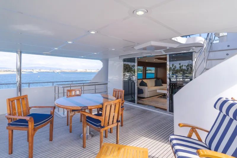 White Lotus Yacht Photos Pics Luxurious 2011 President Sterling Tri-Deck yacht with elegant outdoor seating and ocean view.