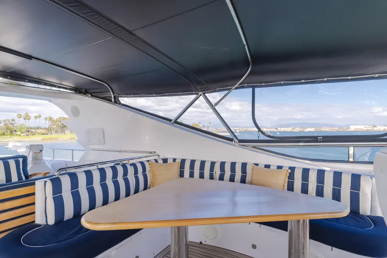 White Lotus Yacht Photos Pics Luxurious 2011 President Sterling Tri-Deck yacht with elegant outdoor seating and ocean view.