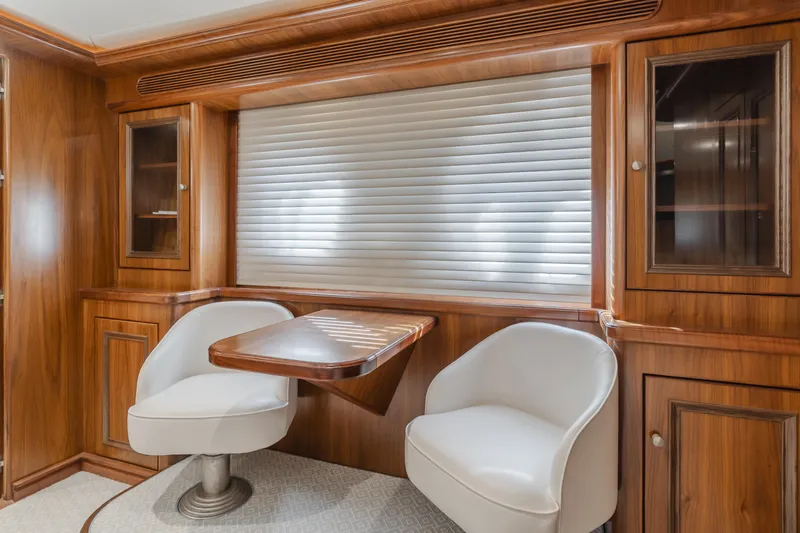 White Lotus Yacht Photos Pics Luxurious 2011 President Sterling Tri-Deck yacht interior with wood paneling and modern seating.